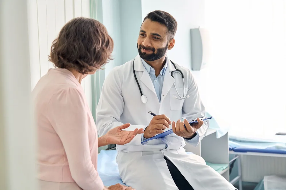 Physician talking with a patient at FirstCare Urgent Care in Oak Lawn, IL